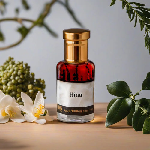 Hina Attar Bottle with flowers & leaves in background